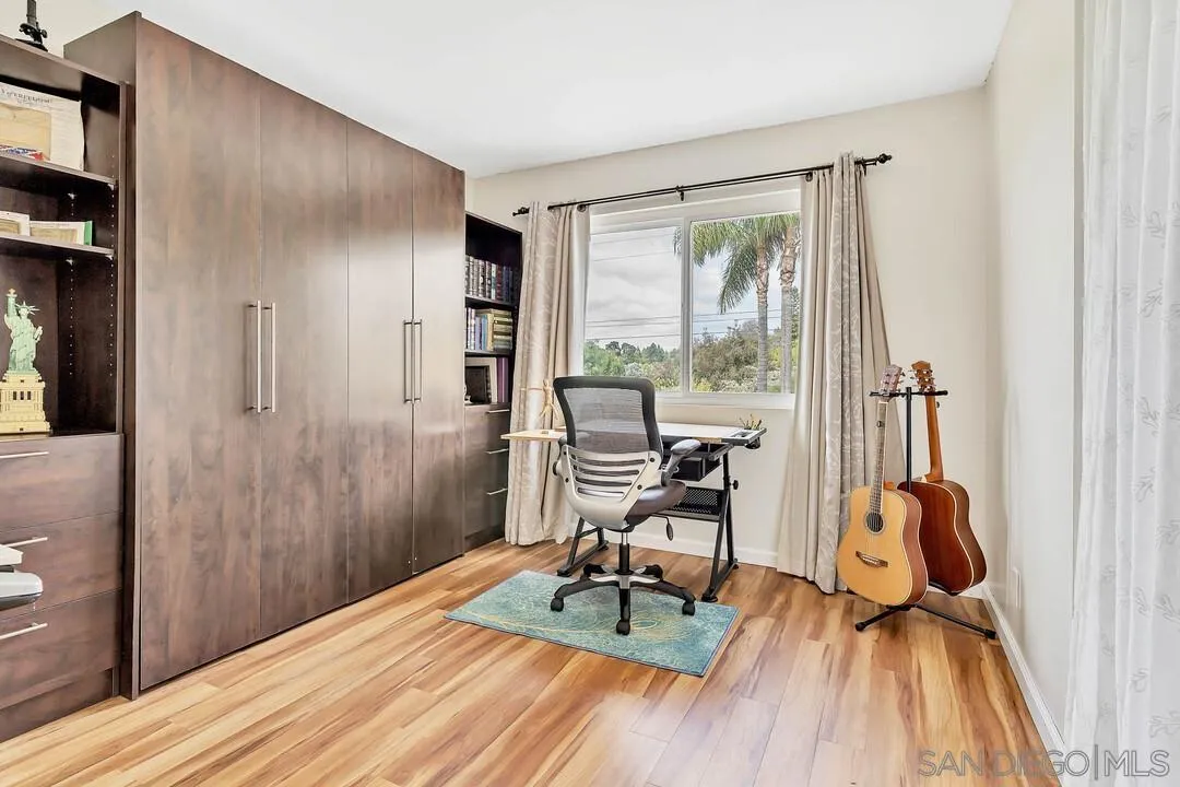 1668 Olmeda Street Encinitas, CA 92024 - Photo 25 of 42 a workspace with furniture and a window