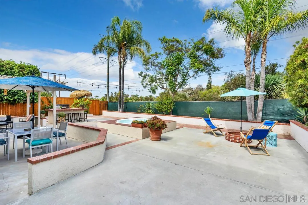 1668 Olmeda Street Encinitas, CA 92024 - Photo 32 of 42 an outdoor patio with swimming pool and outdoor seating
