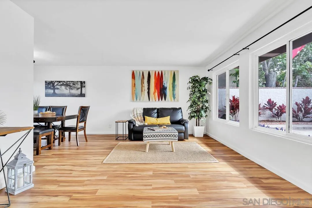 1668 Olmeda Street Encinitas, CA 92024 - Photo 4 of 42 a living room with furniture large window and a table