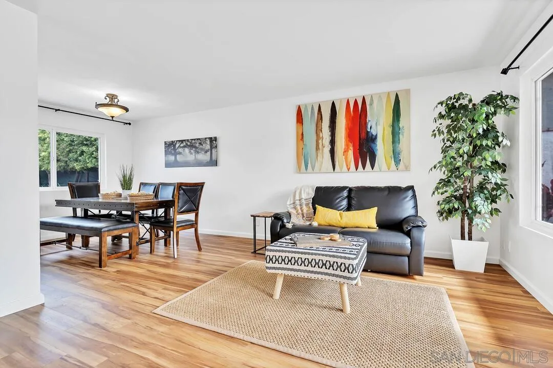 1668 Olmeda Street Encinitas, CA 92024 - Photo 5 of 42 a living room with furniture a rug and a potted plant