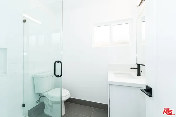 a bathroom with a toilet and a sink