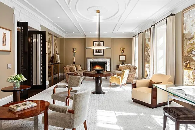 a living room with furniture fireplace and flat screen tv