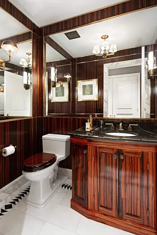 a view of a kitchen with a sink and a chandelier fan
