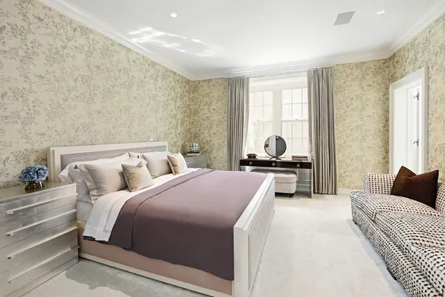 a bathroom with a double vanity sink mirror and bathtub