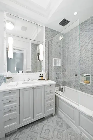 a bedroom with bed couch and window