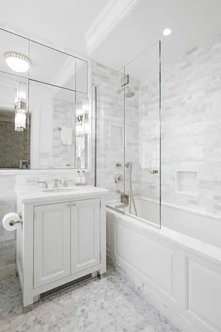 a bedroom with bed and window