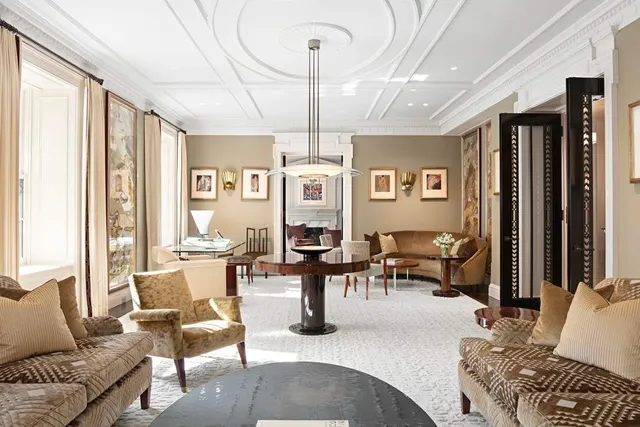 a view of a hallway with stairs and wooden floor