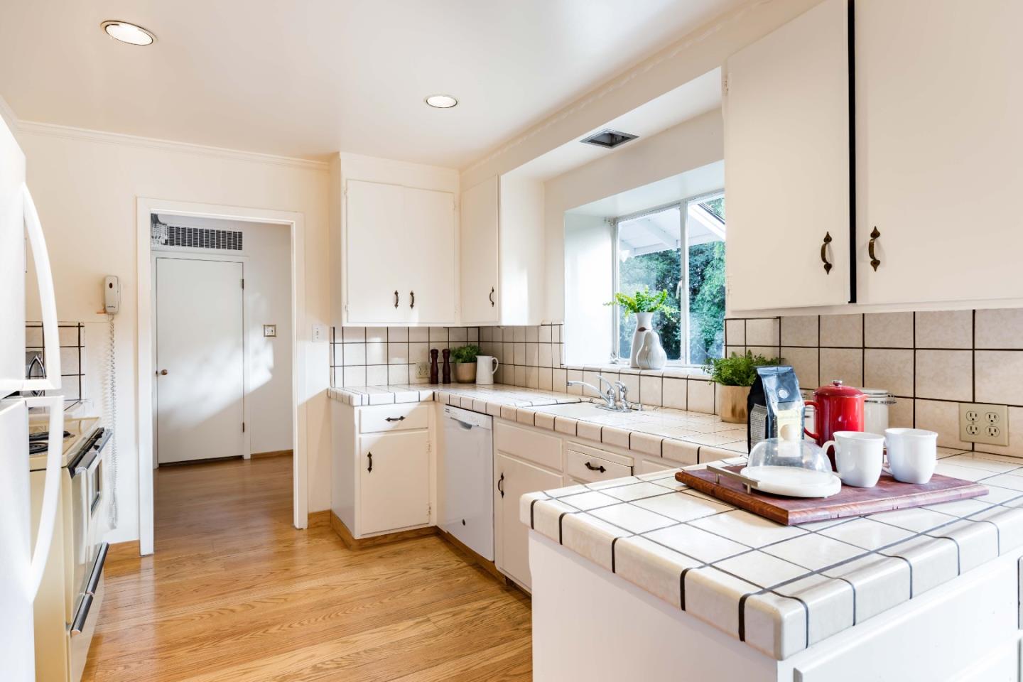 366 Stevick Drive Atherton, CA 94027 - Photo 17 of 29 a kitchen with a white cabinets and refrigerator