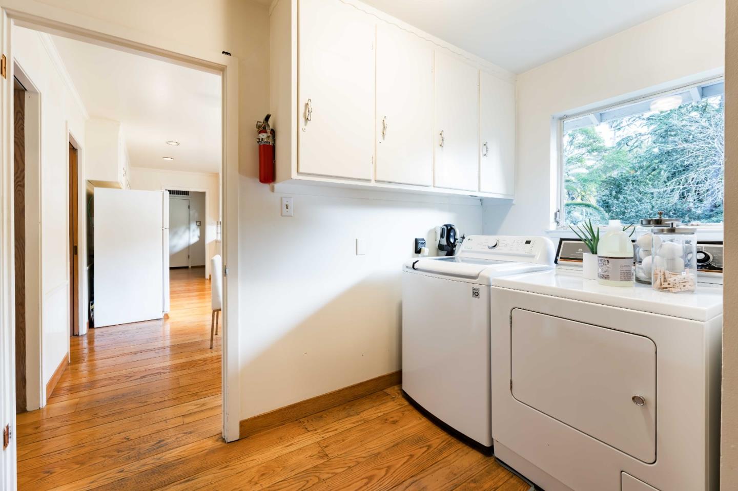 366 Stevick Drive Atherton, CA 94027 - Photo 18 of 29 a room with white cabinets and washer