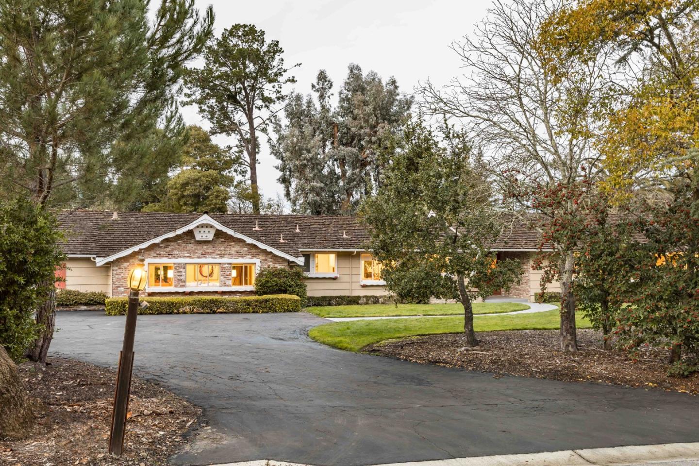366 Stevick Drive Atherton, CA 94027 - Photo 6 of 29 a front view of a house with a garden and trees