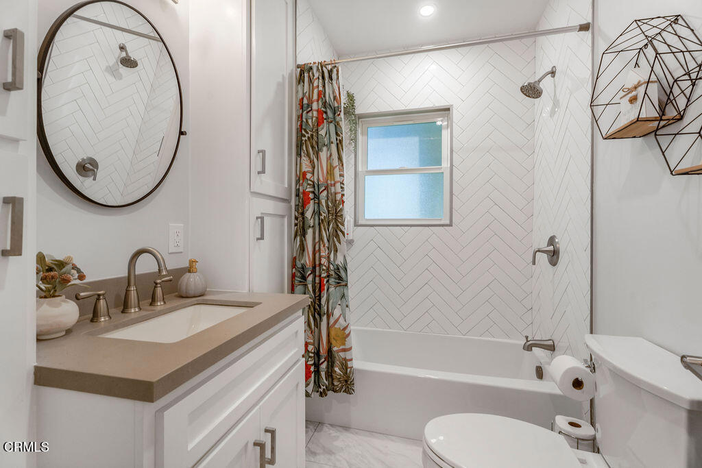 3500 Fairchild Street La Crescenta, CA 91214 - Photo 14 of 54 a bathroom with a sink a toilet and a mirror