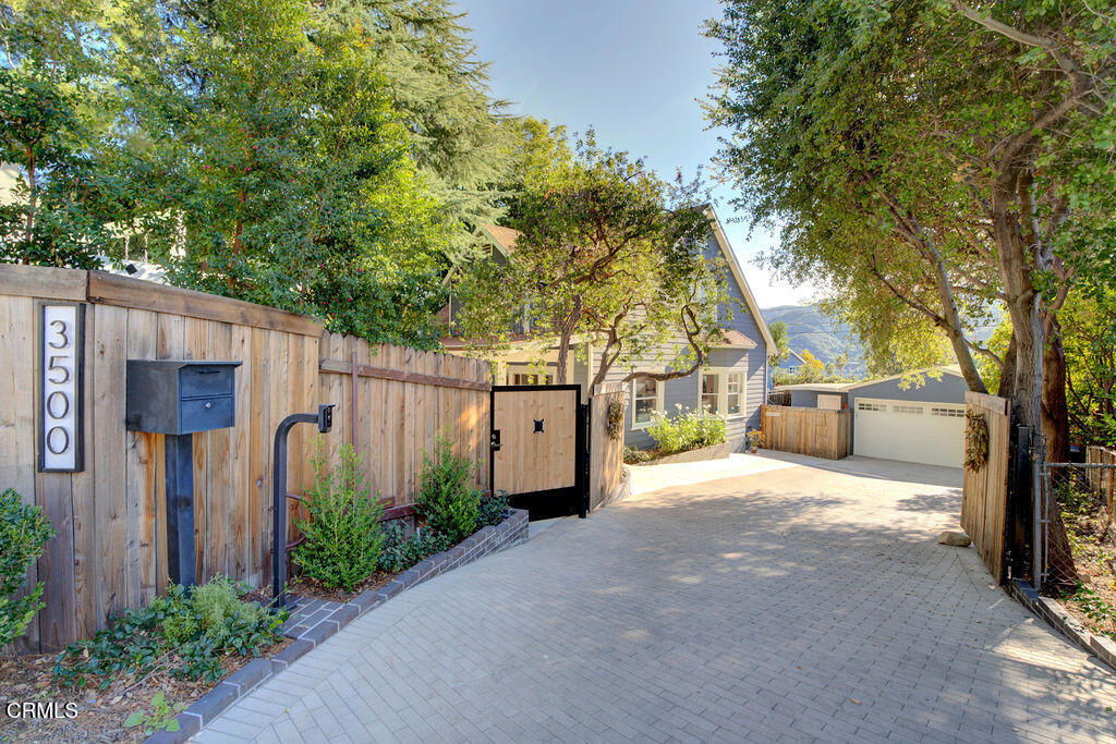 3500 Fairchild Street La Crescenta, CA 91214 - Photo 26 of 54 a view of a house with wooden fence and trees