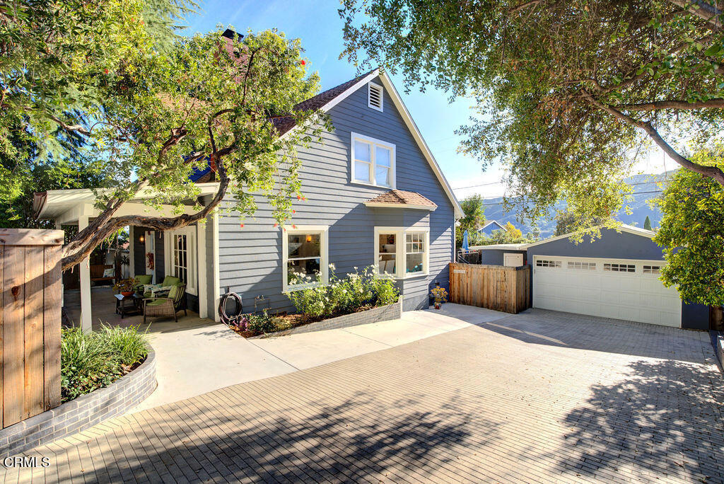 3500 Fairchild Street La Crescenta, CA 91214 - Photo 4 of 54 a front view of a house with a yard and garage