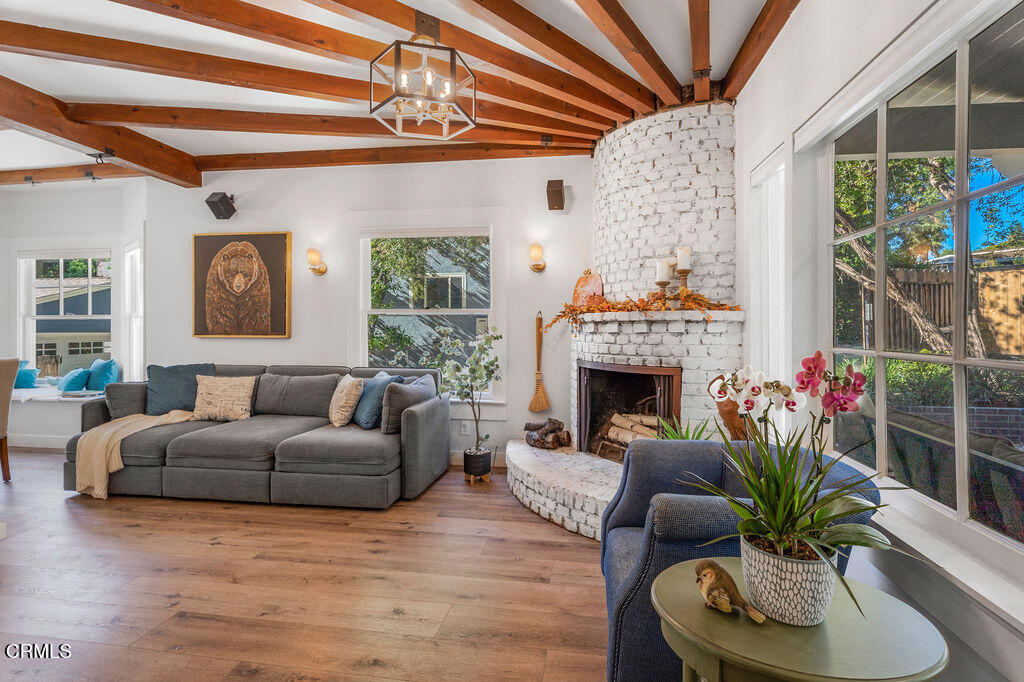 3500 Fairchild Street La Crescenta, CA 91214 - Photo 7 of 54 a living room with furniture a fireplace and a potted plant