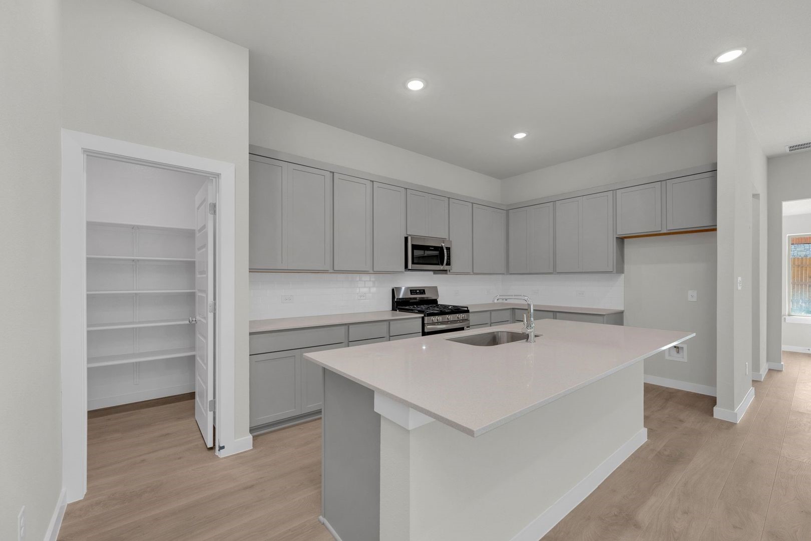 31104 Rena Coast Drive Huffman, TX 77336 - Photo 3 of 35 Kitchen in the Pecos home plan by Trophy Signature Homes – REPRESENTATIVE PHOTO