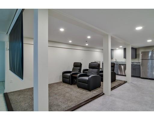 75 Evergreen Road Natick, MA 01760 - Photo 24 of 36 a living room with furniture and a flat screen tv