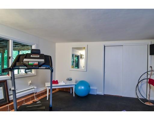 75 Evergreen Road Natick, MA 01760 - Photo 26 of 36 a living room with furniture and gym equipment