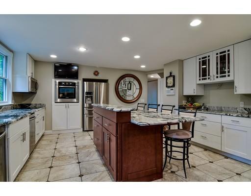 75 Evergreen Road Natick, MA 01760 - Photo 10 of 36 a open kitchen with stainless steel appliances granite countertop a sink and a refrigerator