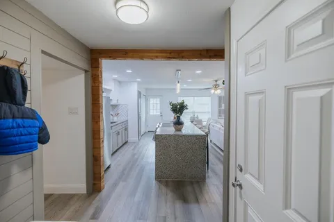 a view of a hallway and dining room