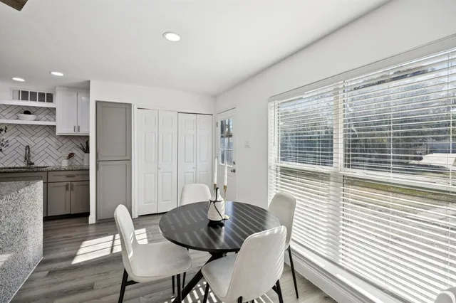 a view of a dining room with furniture and windows
