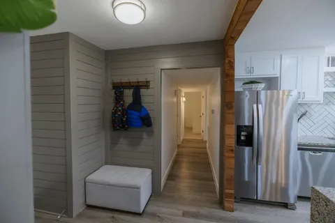 a hallway with some storage and utility room