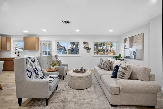 a living room with furniture and a large window