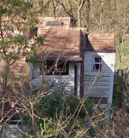a view of a house with a tree