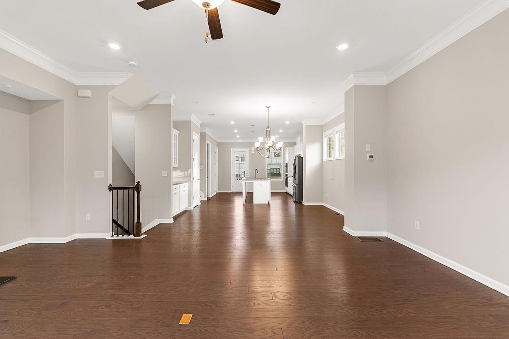 759 Topsail Lane Alpharetta, GA 30005 - Photo 13 of 50 a view of kitchen and hall with wooden floor