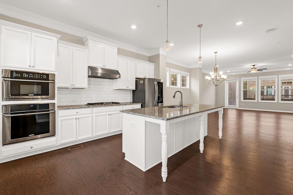 759 Topsail Lane Alpharetta, GA 30005 - Photo 20 of 50 a large white kitchen with stainless steel appliances