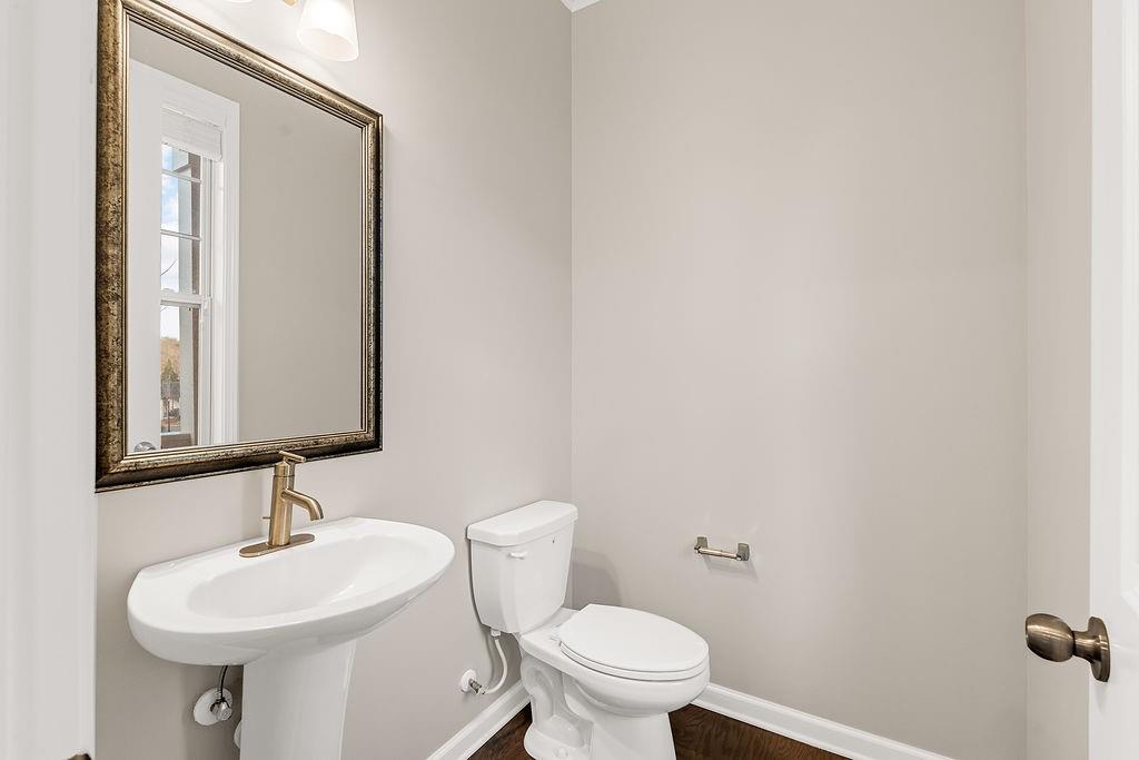 759 Topsail Lane Alpharetta, GA 30005 - Photo 23 of 50 a bathroom with a sink a toilet and mirror