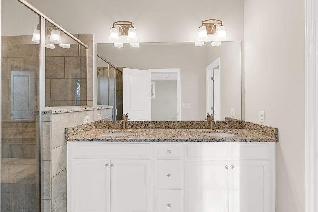 759 Topsail Lane Alpharetta, GA 30005 - Photo 31 of 50 a bathroom with a granite countertop sink and a mirror