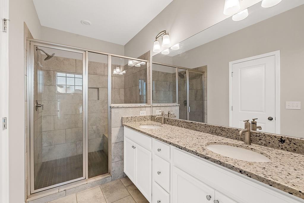 759 Topsail Lane Alpharetta, GA 30005 - Photo 32 of 50 a bathroom with a granite countertop sink mirror and shower