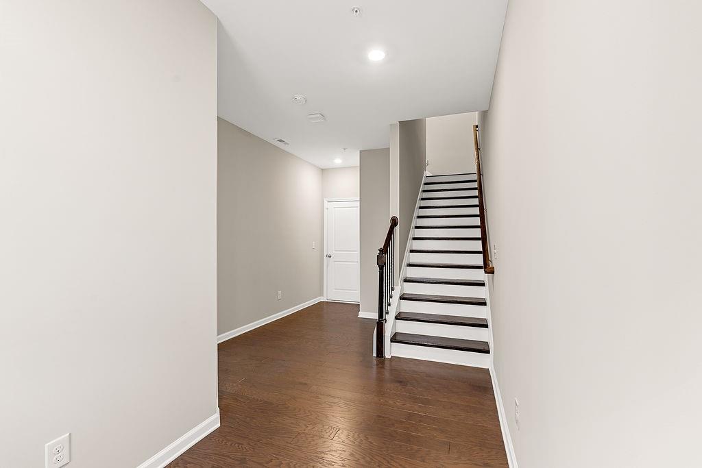 759 Topsail Lane Alpharetta, GA 30005 - Photo 4 of 50 a view of a hallway with stairs and wooden floor