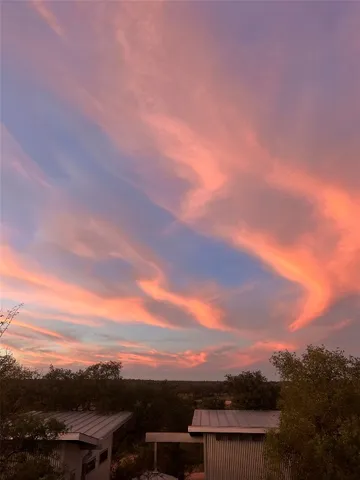 an aerial view of a house with yard lake view and mountain view