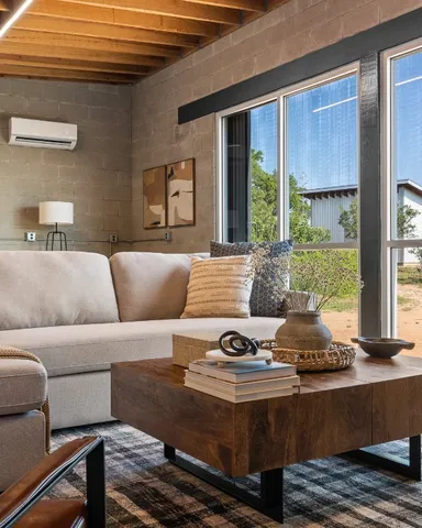 a living room with furniture and a window