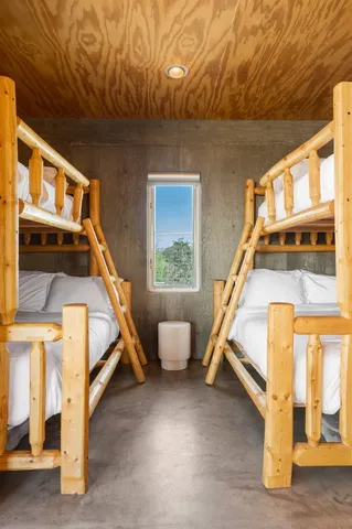 a living room with furniture city view and large windows