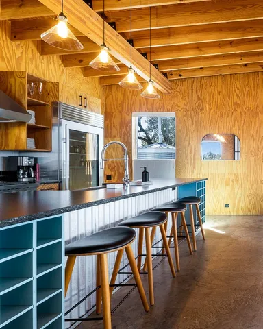 an aerial view of a house with pool