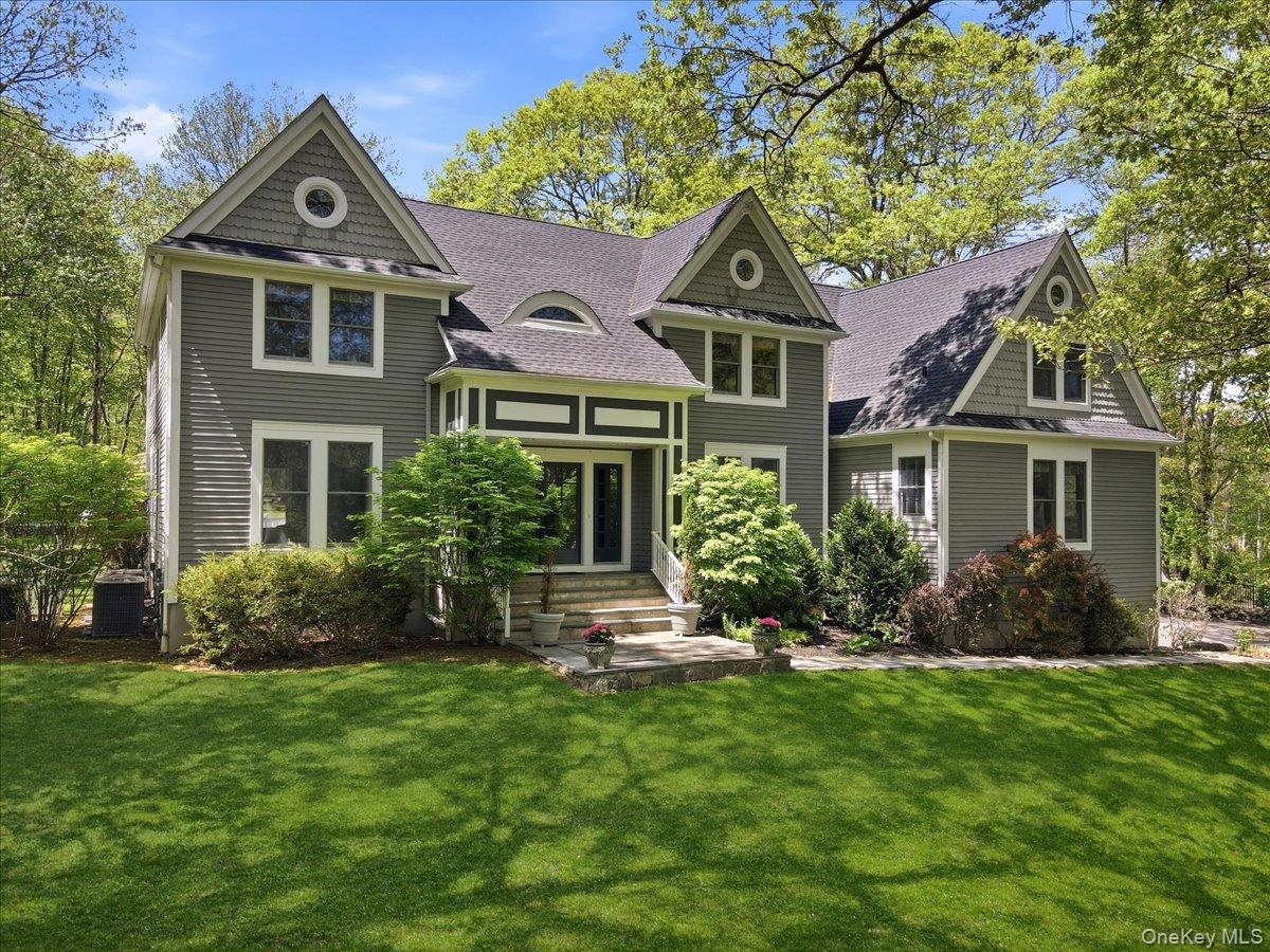 44 Scofield Road Pound Ridge, NY 10576 - Photo 1 of 36 front view of a house with a yard