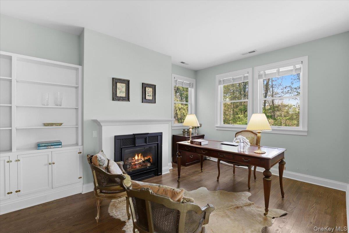 44 Scofield Road Pound Ridge, NY 10576 - Photo 15 of 36 a living room with furniture a window and a fireplace