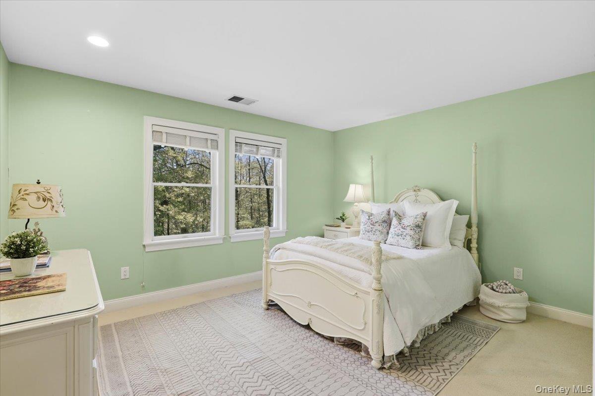 44 Scofield Road Pound Ridge, NY 10576 - Photo 22 of 36 a bedroom with a bed and a window