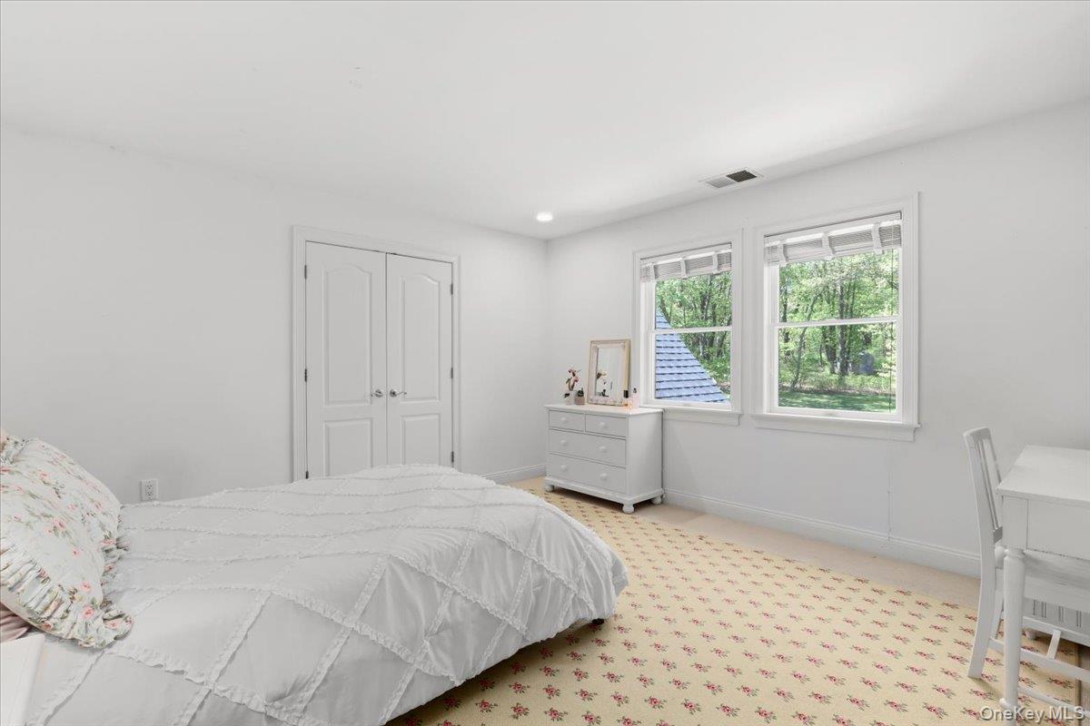 44 Scofield Road Pound Ridge, NY 10576 - Photo 24 of 36 a bedroom with a bed and a window