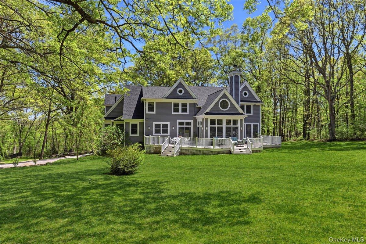 44 Scofield Road Pound Ridge, NY 10576 - Photo 32 of 36 a front view of a house with garden