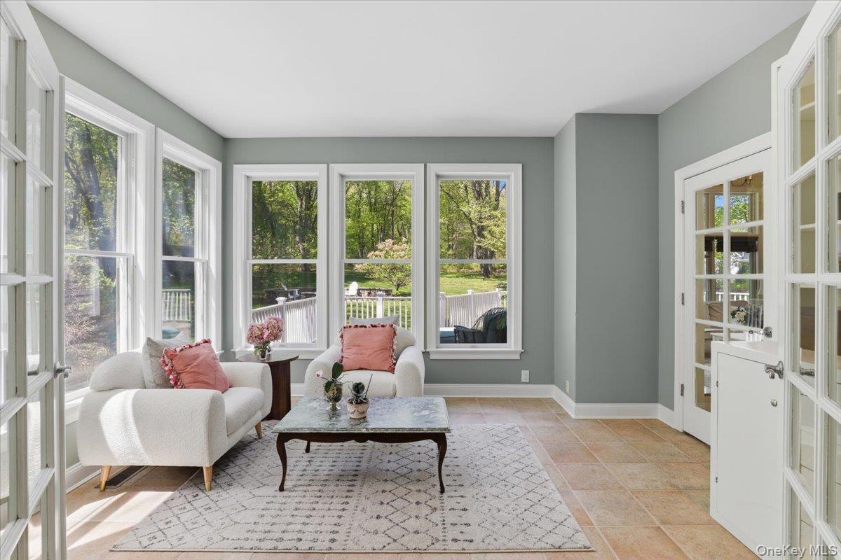 44 Scofield Road Pound Ridge, NY 10576 - Photo 5 of 36 a living room with furniture and a large window