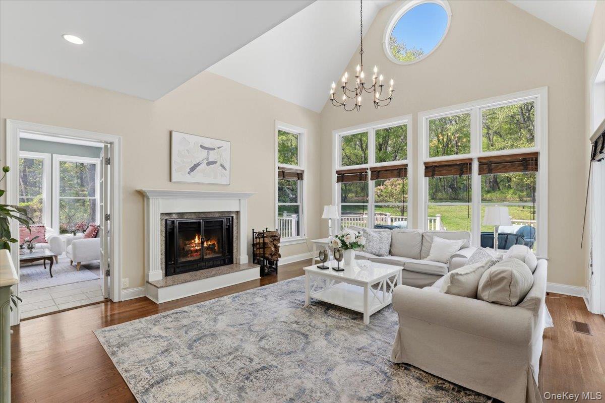 44 Scofield Road Pound Ridge, NY 10576 - Photo 6 of 36 a living room with furniture and a fireplace