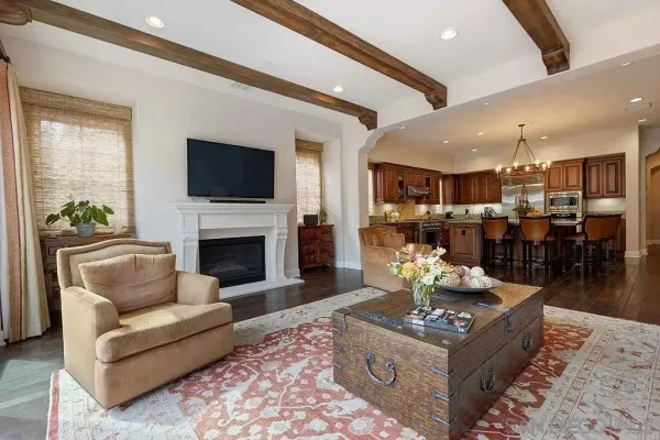 a living room with fireplace furniture and a flat screen tv