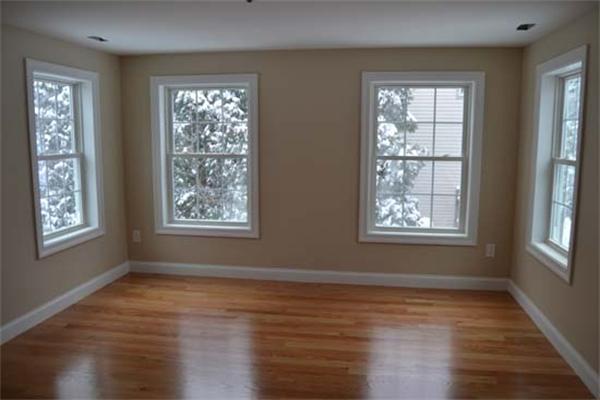 1 Henderson Avenue Andover, MA 01810 - Photo 18 of 26 a view of an empty room with wooden floor and a window