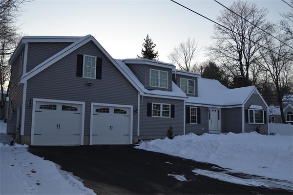 1 Henderson Avenue Andover, MA 01810 - Photo 2 of 26 a front view of a house with a garden