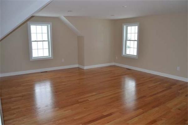 1 Henderson Avenue Andover, MA 01810 - Photo 23 of 26 an empty room with wooden floor and windows