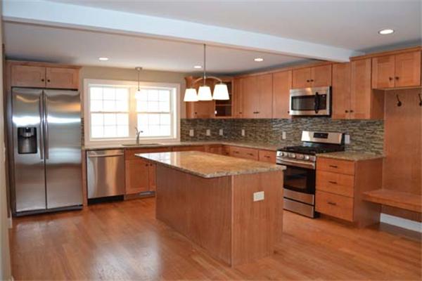 1 Henderson Avenue Andover, MA 01810 - Photo 3 of 26 a kitchen with granite countertop a sink cabinets and stainless steel appliances
