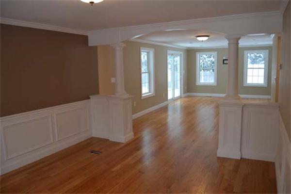 1 Henderson Avenue Andover, MA 01810 - Photo 7 of 26 an empty room with wooden floor and windows